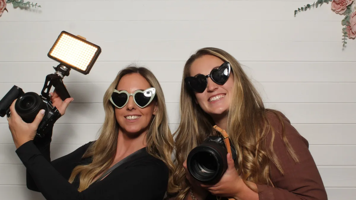 Event photographers enjoying a corporate photo booth