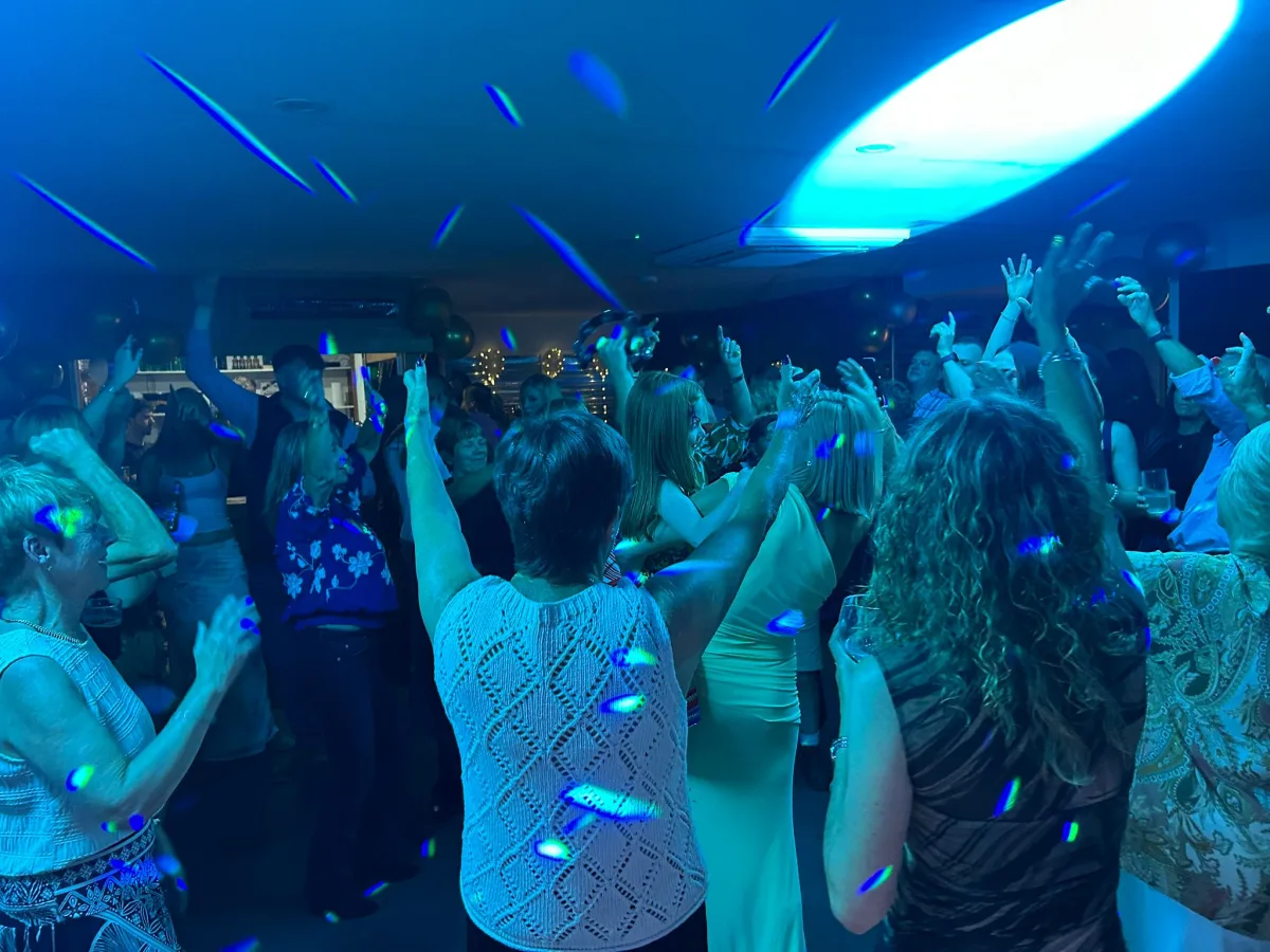 Wedding DJ sound and lighting beside a white LED dance floor